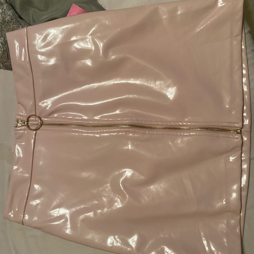 Pink leather skirt.